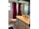 Bathroom with a vanity sink, tiled floors, and a shower-tub combination at 9375 Woodbreeze Blvd, Windermere, FL 34786