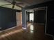Bedroom featuring hardwood floors, mirrored closet, and a window at 9375 Woodbreeze Blvd, Windermere, FL 34786