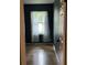 A bedroom with hardwood floors, a window with curtains and views at 9375 Woodbreeze Blvd, Windermere, FL 34786