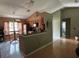 Open kitchen with modern appliances, a breakfast bar, and ample natural light at 9375 Woodbreeze Blvd, Windermere, FL 34786