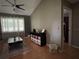 Comfortable living room with ample natural light, ceiling fan, and hardwood floors at 9375 Woodbreeze Blvd, Windermere, FL 34786
