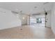 Large garage space with tile flooring and a glass panel garage door, leading to the home's interior at 9670 Rodbell St, Orlando, FL 32827