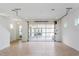 Spacious garage featuring tile flooring and a modern glass panel garage door for natural light at 9670 Rodbell St, Orlando, FL 32827