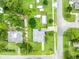Aerial view of the property highlighting the backyard pool, shed, and green lawn within property lines at 1 W Pierce Ave, Orlando, FL 32809
