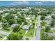 Aerial view showcases the property within a suburban neighborhood and highlighting proximity to local lakes at 1 W Pierce Ave, Orlando, FL 32809