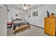 Comfortable bedroom with natural light, neutral decor, ceiling fan, and ample storage at 1 W Pierce Ave, Orlando, FL 32809