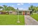 Charming single-story home with a well-maintained lawn and inviting front porch at 1 W Pierce Ave, Orlando, FL 32809