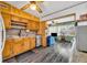 Functional kitchen with wooden cabinets, stainless steel dishwasher and open floor plan at 1 W Pierce Ave, Orlando, FL 32809
