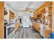Open kitchen features stainless appliances, ample counter space and a view to the living area at 1 W Pierce Ave, Orlando, FL 32809