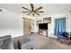 Spacious living room with ceiling fan, comfortable seating and bright, natural light at 1 W Pierce Ave, Orlando, FL 32809