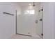 Luxurious glass-enclosed shower featuring black hardware, rain shower head, and built-in niche at 10061 Dulbecco St, Orlando, FL 32827