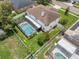 Aerial view of home with a screened pool and fenced backyard at 1109 Needlewood Loop, Oviedo, FL 32765