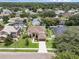 Sprawling two-story home boasts lush landscaping, mature trees, and a charming front lawn at 1109 Needlewood Loop, Oviedo, FL 32765