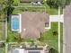 Overhead view of home with a screened pool and well-maintained landscaping at 1109 Needlewood Loop, Oviedo, FL 32765