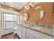 Bathroom features granite countertops, dual sinks and vanity, and a glass enclosed shower at 1109 Needlewood Loop, Oviedo, FL 32765