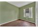 Cozy bedroom with hardwood floors, closet, and window providing natural light and ventilation at 1109 Needlewood Loop, Oviedo, FL 32765