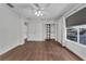 This bedroom is bright with hardwood floors, a closet, and a ceiling fan at 1109 Needlewood Loop, Oviedo, FL 32765