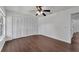 A spacious bedroom featuring gorgeous wood floors, a ceiling fan and large closet at 1109 Needlewood Loop, Oviedo, FL 32765