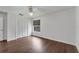 This bedroom features hardwood floors, a ceiling fan, and a closet at 1109 Needlewood Loop, Oviedo, FL 32765
