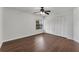 A spacious bedroom with beautiful wood floors, closet and a ceiling fan at 1109 Needlewood Loop, Oviedo, FL 32765