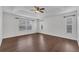Spacious primary bedroom featuring wood floors, ample natural light, and neutral decor at 1109 Needlewood Loop, Oviedo, FL 32765