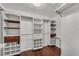 The walk-in closet is well-appointed with custom organizers and a hardwood floor at 1109 Needlewood Loop, Oviedo, FL 32765