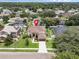 Stunning two-story home with a well-manicured lawn, attached garage, and classic architectural details at 1109 Needlewood Loop, Oviedo, FL 32765