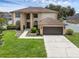 Stunning two-story home with a well-manicured lawn and a two-car garage at 1109 Needlewood Loop, Oviedo, FL 32765
