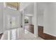 Elegant foyer boasts hardwood floors, high ceilings, and a decorative front door with sidelights at 1109 Needlewood Loop, Oviedo, FL 32765