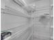 Walk-in pantry with adjustable shelving for ample storage and organization in this kitchen at 1109 Needlewood Loop, Oviedo, FL 32765