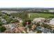 Aerial view of property close to community school at 1130 Woodsong Way, Clermont, FL 34714