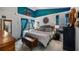Cozy bedroom featuring a comfortable bed, blue accents, and natural light at 1130 Woodsong Way, Clermont, FL 34714