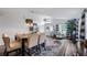 Bright dining room with high ceilings, modern lighting, and comfortable seating at 1130 Woodsong Way, Clermont, FL 34714