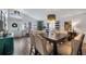 Open-concept dining area features stylish furniture, modern lighting, and seamless flow at 1130 Woodsong Way, Clermont, FL 34714