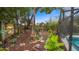 Extensive landscaping surrounding the pool at 1130 Woodsong Way, Clermont, FL 34714