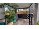 View of covered patio featuring grill, drying rack and outdoor furniture at 1130 Woodsong Way, Clermont, FL 34714