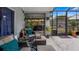 Covered patio with comfortable seating and access to the backyard at 1130 Woodsong Way, Clermont, FL 34714