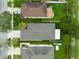 An aerial view of a backyard featuring a patio, greenery, and well-maintained lawns at 15169 Harrowgate Way, Winter Garden, FL 34787