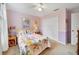 Bright bedroom with floral bedding, pink walls, and a spacious closet at 15169 Harrowgate Way, Winter Garden, FL 34787