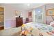 Charming bedroom features floral bedding, pink walls, and shuttered windows at 15169 Harrowgate Way, Winter Garden, FL 34787