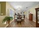 Dining area with hardwood floors, a chandelier, and plenty of natural light at 15169 Harrowgate Way, Winter Garden, FL 34787