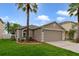 Charming single-Gathering home with well-manicured lawn and mature palm trees at 15169 Harrowgate Way, Winter Garden, FL 34787