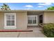 The front of a single Gathering home shows a well-kept lawn and neutral paint at 15169 Harrowgate Way, Winter Garden, FL 34787