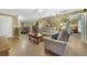 Living room featuring hardwood floors, neutral colors, and ample natural light at 15169 Harrowgate Way, Winter Garden, FL 34787