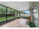 Enclosed patio with tile flooring, providing a relaxing outdoor living space at 15169 Harrowgate Way, Winter Garden, FL 34787