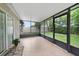 Enclosed patio providing panoramic views of the yard, blending indoor comfort with outdoor scenery at 15169 Harrowgate Way, Winter Garden, FL 34787