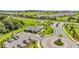 High-angle view of the community pool and amenity center with manicured landscaping and surrounding community at 15954 Winding Bluff Dr, Montverde, FL 34756