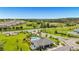Overhead view of the community pool and recreation center, showcasing surrounding greenery and amenities at 15954 Winding Bluff Dr, Montverde, FL 34756