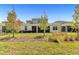 Spacious backyard with manicured lawn and patio views, perfect for outdoor activities and relaxation at 15954 Winding Bluff Dr, Montverde, FL 34756