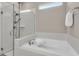 Bathroom featuring a separate tiled shower with glass door and a relaxing soaking tub at 15954 Winding Bluff Dr, Montverde, FL 34756